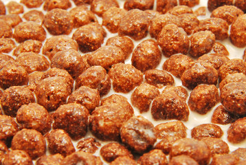 Chocolate cereals with milk background