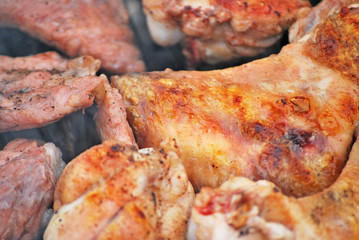 Fried meat on grill