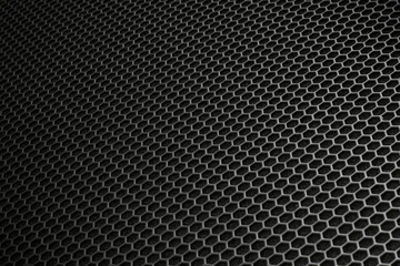 Foto op Plexiglas Metaal Zwarte ijzeren exagonale textuur. Industriële achtergrond
