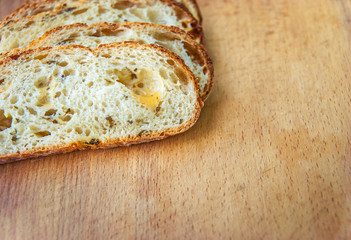 Closeup of sliced bread on a chopping board
