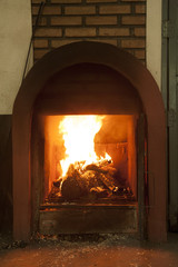 Fireplace in small wood drying factory