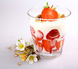Strawberry with yogurt in glass and cereal