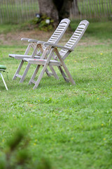 Closeup of chairs set in garden