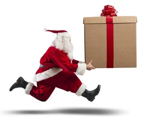 Running Santa Claus with big gift