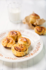 Brioches with cinnamon and glass of milk
