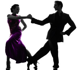 couple man woman ballroom dancers tangoing  silhouette