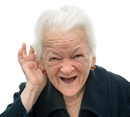 old woman putting hand to her ear. Bad hearing