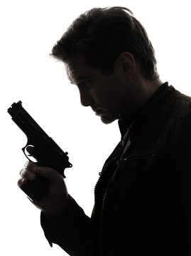 man killer policeman holding gun portrait silhouette