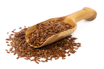 Wooden scoop with flax seeds
