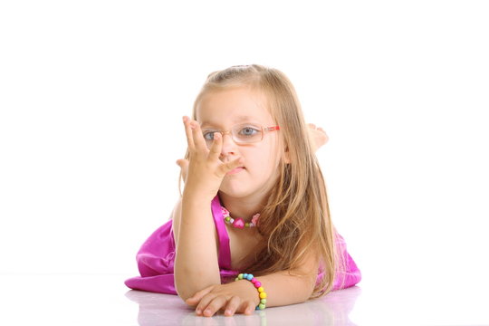 cute little girl lying on the floor isolated