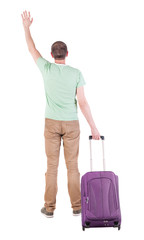 back view of  man  with suitcase.