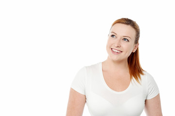 Fototapeta premium Attractive young lady looking upwards