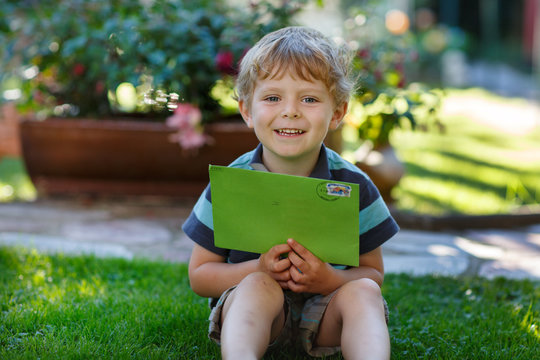 Little Boy Reading First Letter From Friend