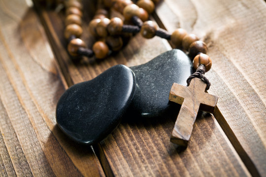 stone hearts with rosary beads