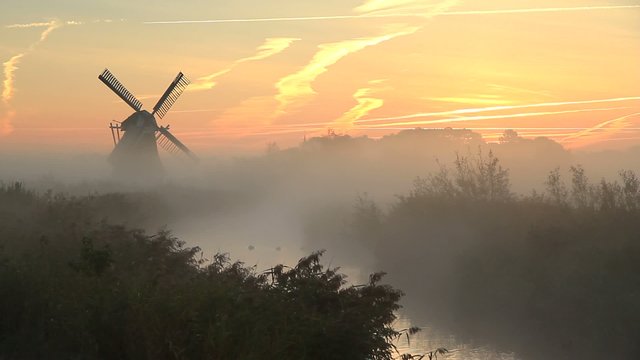 Autumn sunrise at windmill