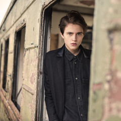 Obraz premium portrait of a fashionable guy in the slums