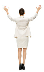 Full-length backview of businesswoman putting her hands up