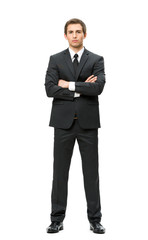 Full-length portrait of businessman with hands crossed