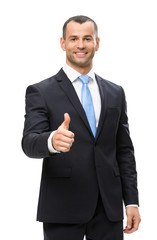 Half-length portrait of businessman thumbing up