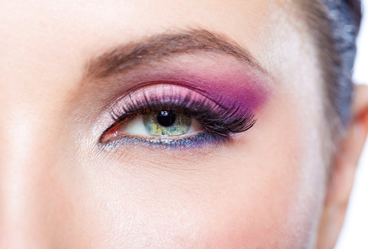Close up of female eye with bright pink makeup