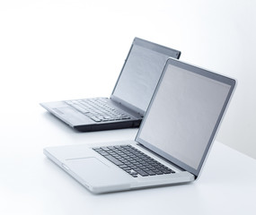 Two laptop on white table