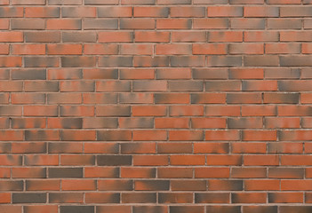 Background of new brick wall in red dark tones