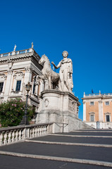 Fototapeta na wymiar The Capitoline Hill cordonata with the statues of Casto. Rome.