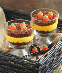 Layered cream cheese and brownie dessert for Halloween