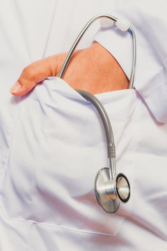 Asain Female Doctor With A Pair Of Stethoscope