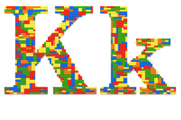 Letter K built from toy bricks in random colors