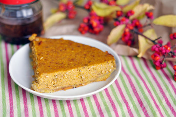 Tasty slice of a pumpkin pie on a plate
