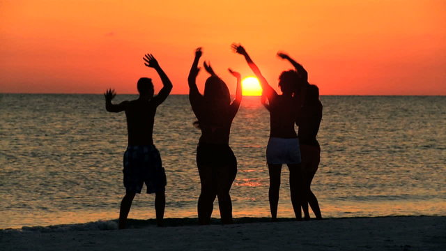 Teenagers Silhouette Dancing Beach Sunset