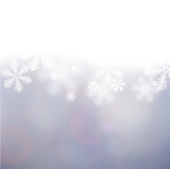 Christmas background with defocused snowflakes.
