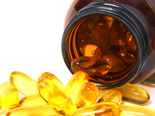 Pile of omega 3 fish oil capsules isolated on white  background