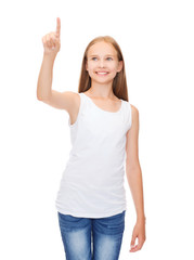 Fototapeta na wymiar girl in blank white shirt pointing to something