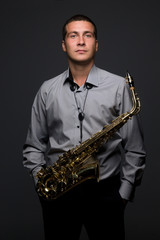 Fototapeta na wymiar Portrait of young saxophonist