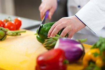 Chef cutting vegetables