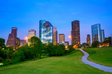 Houston Texas modern skyline at sunset twilight from park