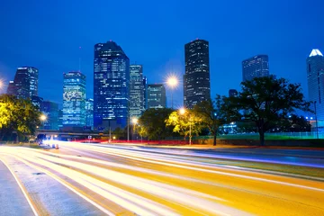 Fotobehang Houston Texas skyline bij zonsondergang met verkeerslichten © lunamarina