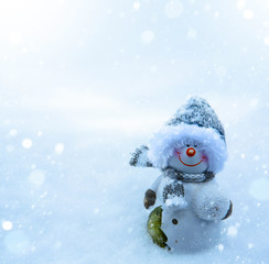 Christmas snowman and blue snow background