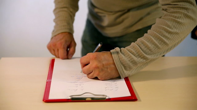 lot of people are signing a document