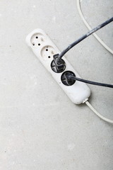 electrical cords connected to power strip building site