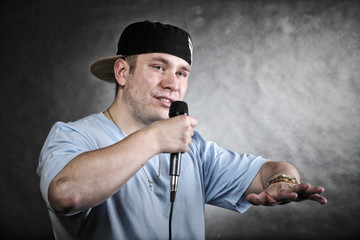 Rap singer man with microphone cool hand gesture