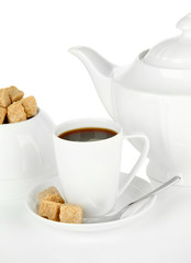 Cup of coffee, sugar-bowl and teapot isolated on white