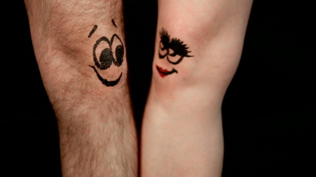 male and female legs with funny faces falling in love