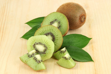 Ripe kiwi on wooden table close-up