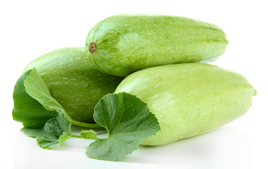Raw zucchini with leaves, isolated on white