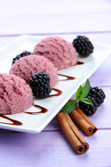 Delicious ice cream on plate on table close-up