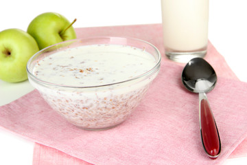 Buckwheat porridge with milk on napkin isolated on white