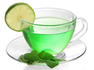 Transparent cup of green tea with sage and lime isolated